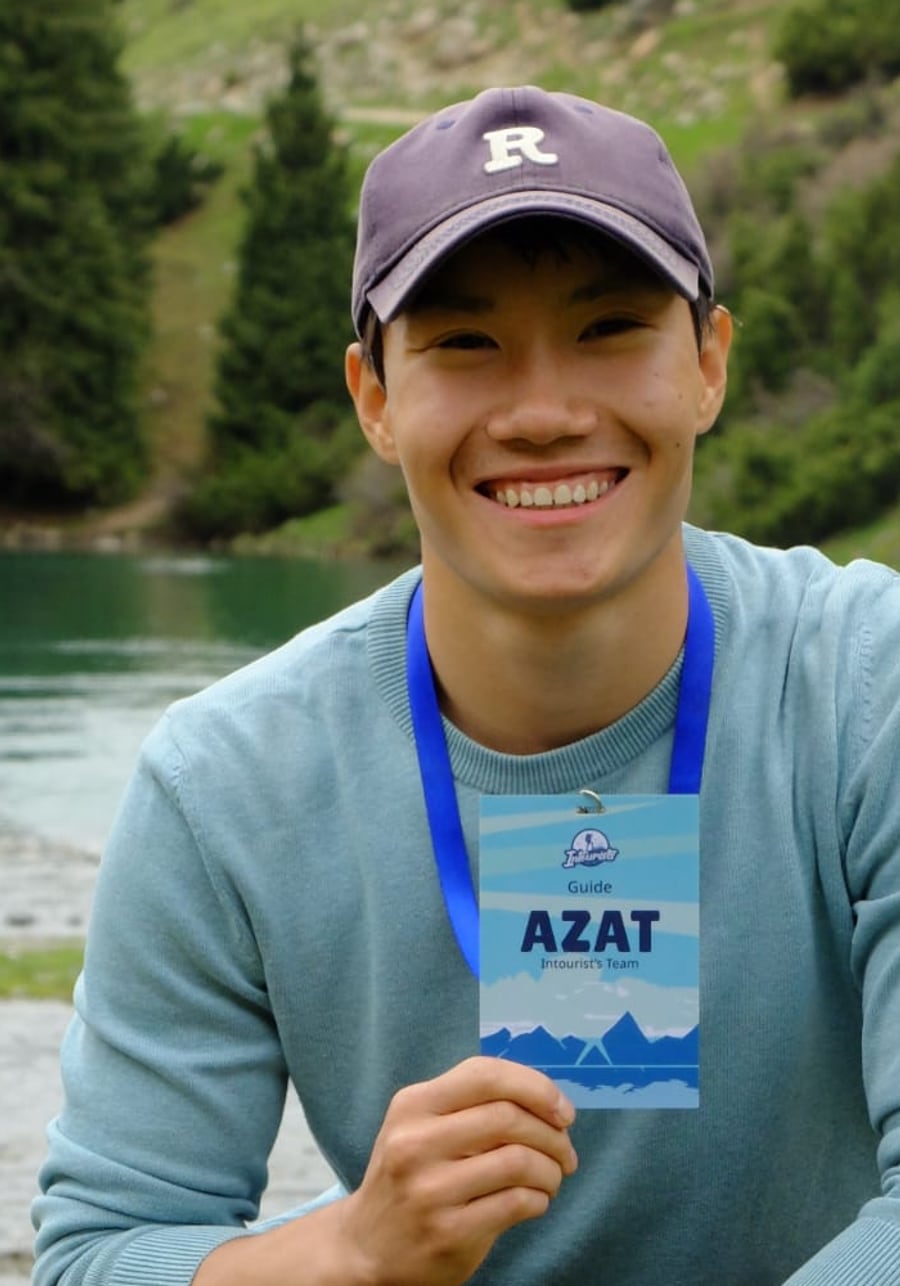 Azat, founder and guide of Azat Tours, by an alpine lake in the Tian Shan