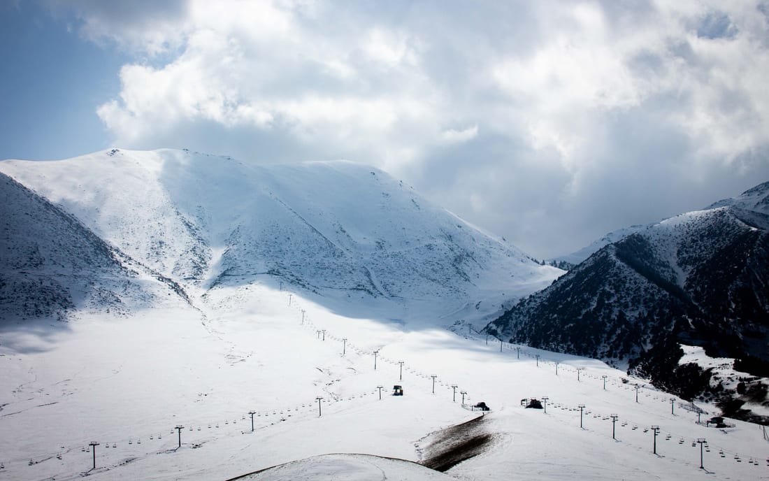 A snow-covered mountain valley in winter