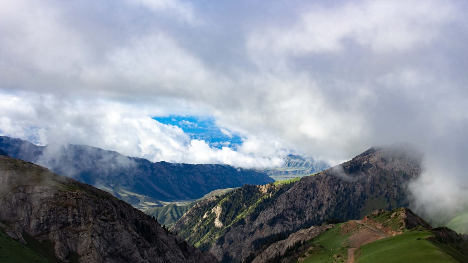 Green ridges and cloud in the Tian Shan, Kyrgyzstan